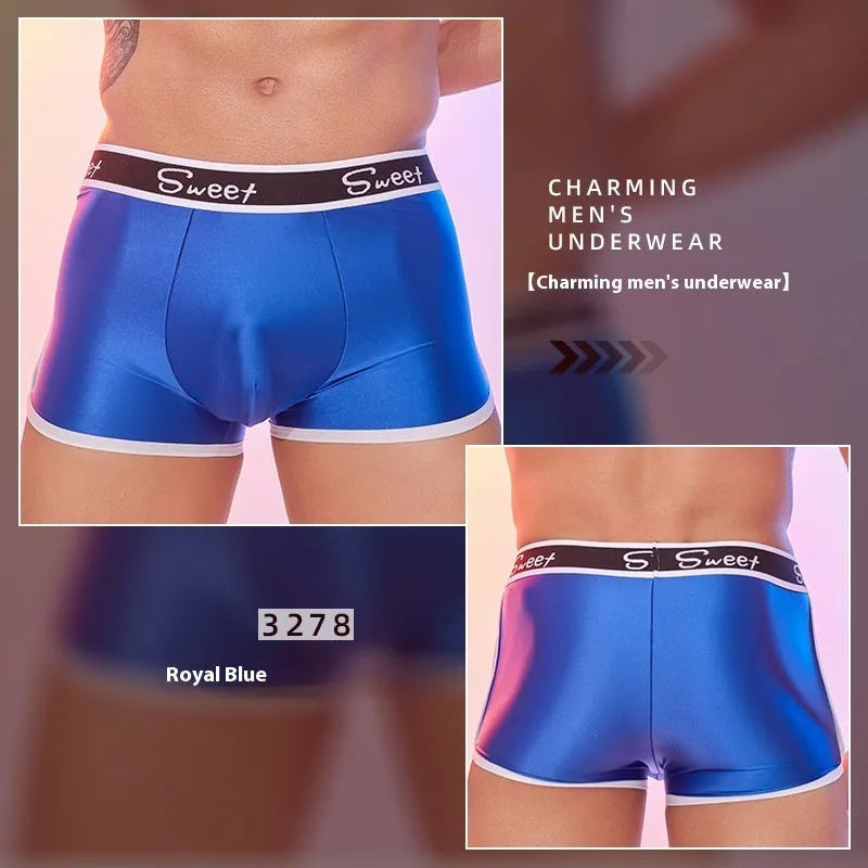 Men's silky nylon boxers in black, white, and sapphire blue colours on a plain background