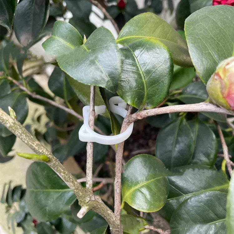 Cat-shaped plastic plant clip in red, yellow, green, and white colours for garden pot marking