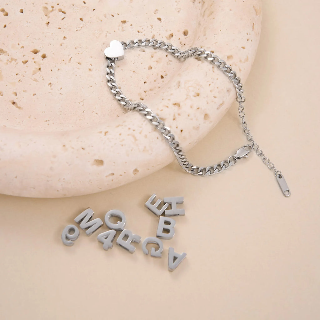 Gold titanium steel necklace with the letter A pendant on a 40.5cm blade-style chain.
