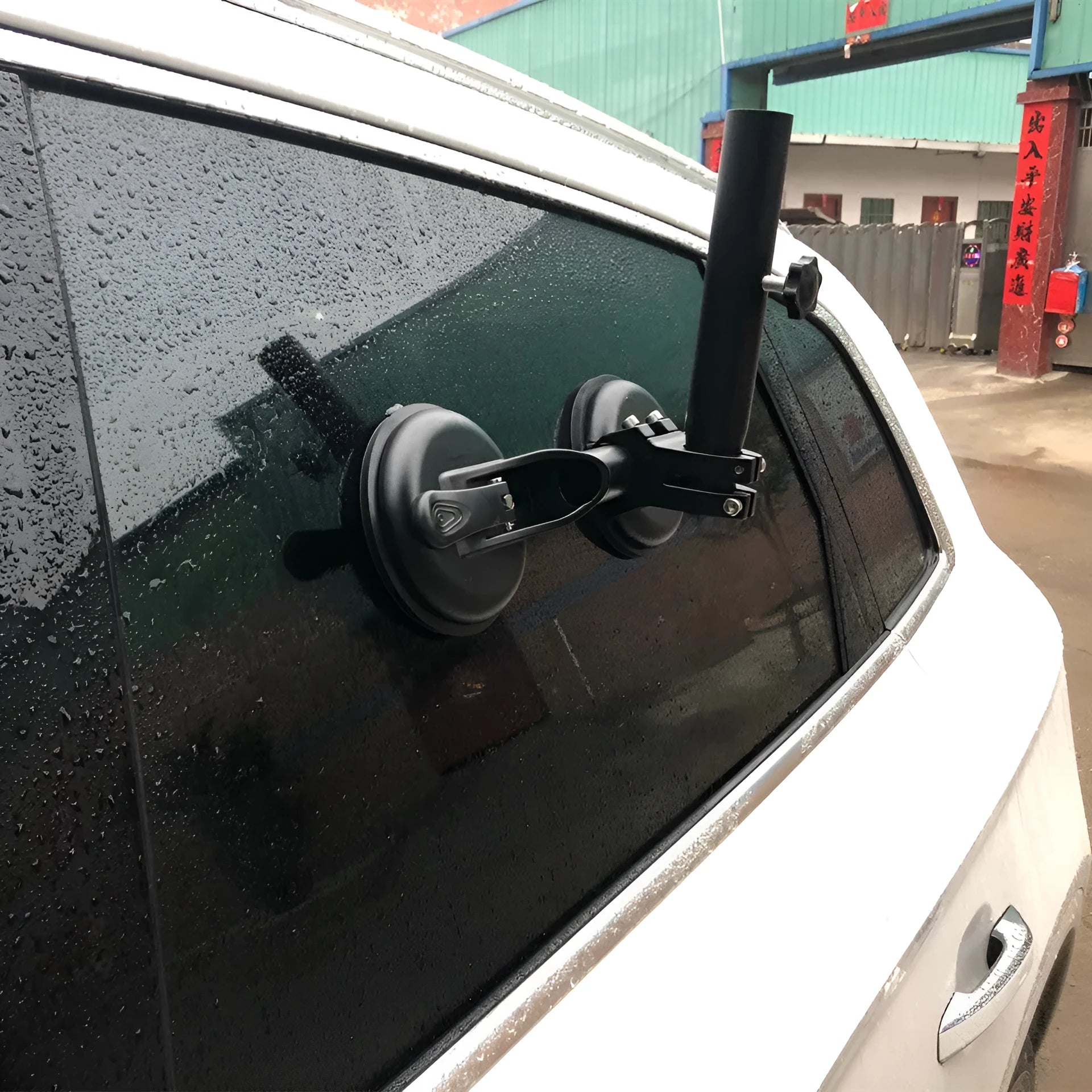 Black off-road car sucker mount with rubber suction cup for attaching flags to vehicle windows.