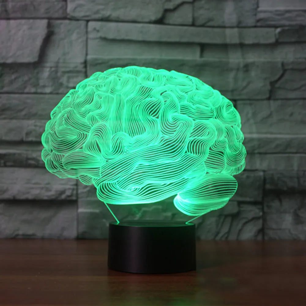 3D brain illusion desk lamp with colour-changing LED lights and remote control on wooden surface