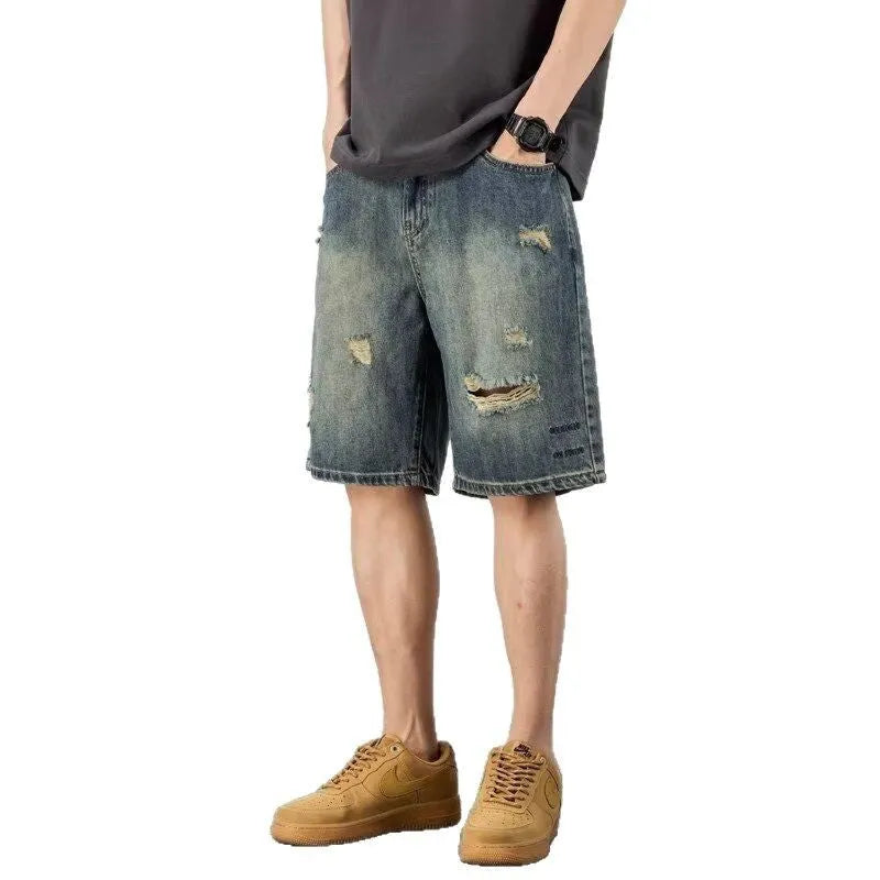 Men's blue retro wash loose fit denim shorts with straight legs on a mannequin.