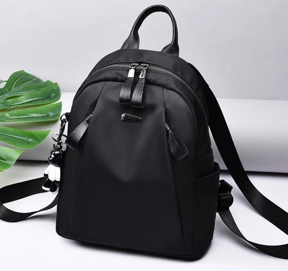 Medium Oxford cloth rucksack in wine red colour showing internal organisation pockets