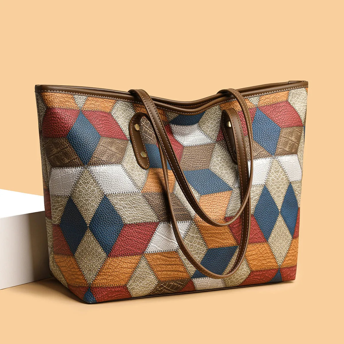 Women's large capacity PVC shoulder handbag with sandwich pockets in blue brown colour