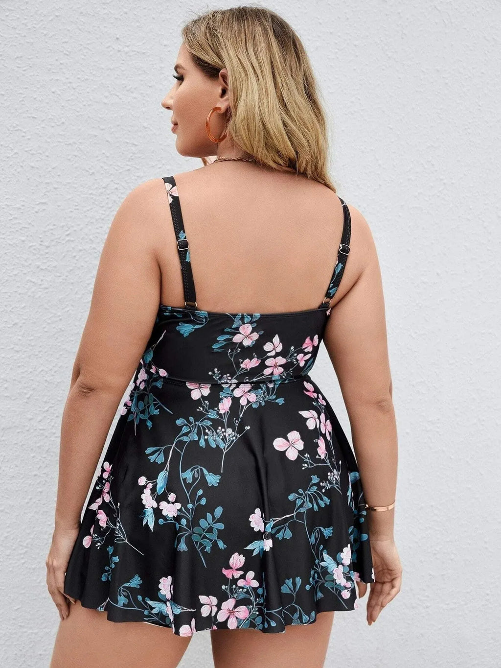 Women's floral print one-piece swimsuit in split colours, showing front design.