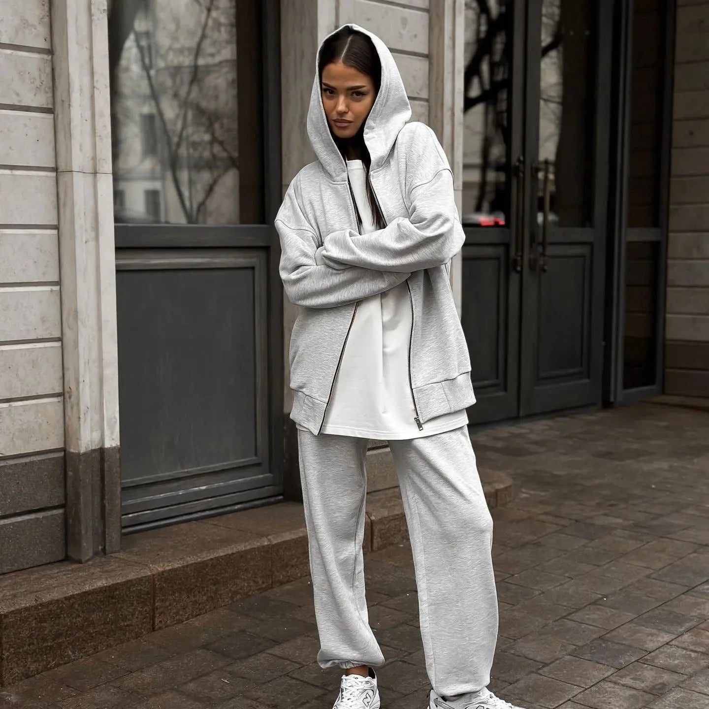 Red loose fit street style coat and trousers two-piece set on a hanger.