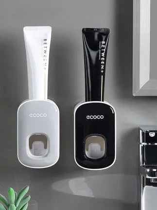 Wall mounted automatic toothpaste holder dispenser set with toothbrush slots and upside-down mouthwash cup in black plastic