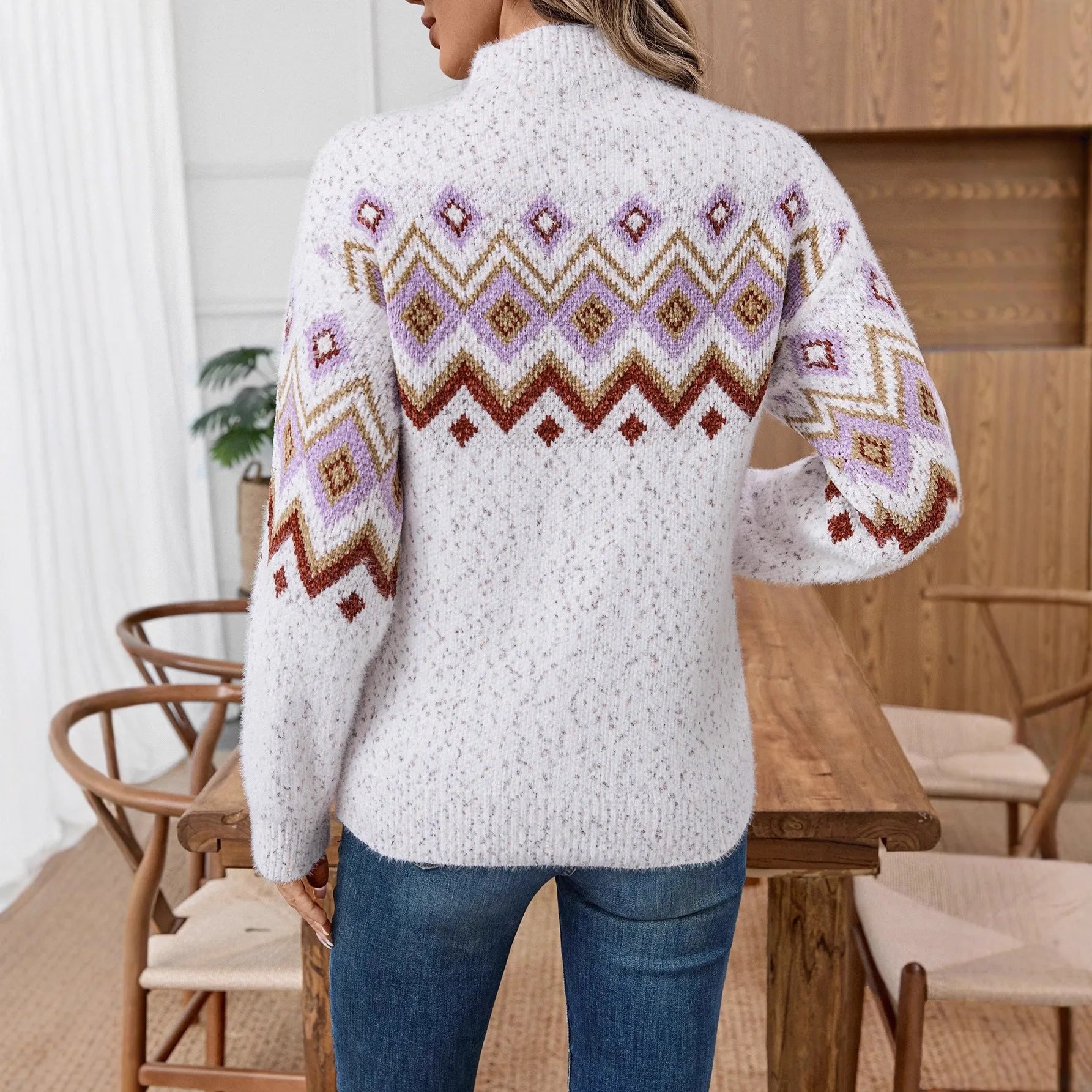 White half turtleneck loose sweater with geometric jacquard pattern, long sleeves, and chunky chenille knit.