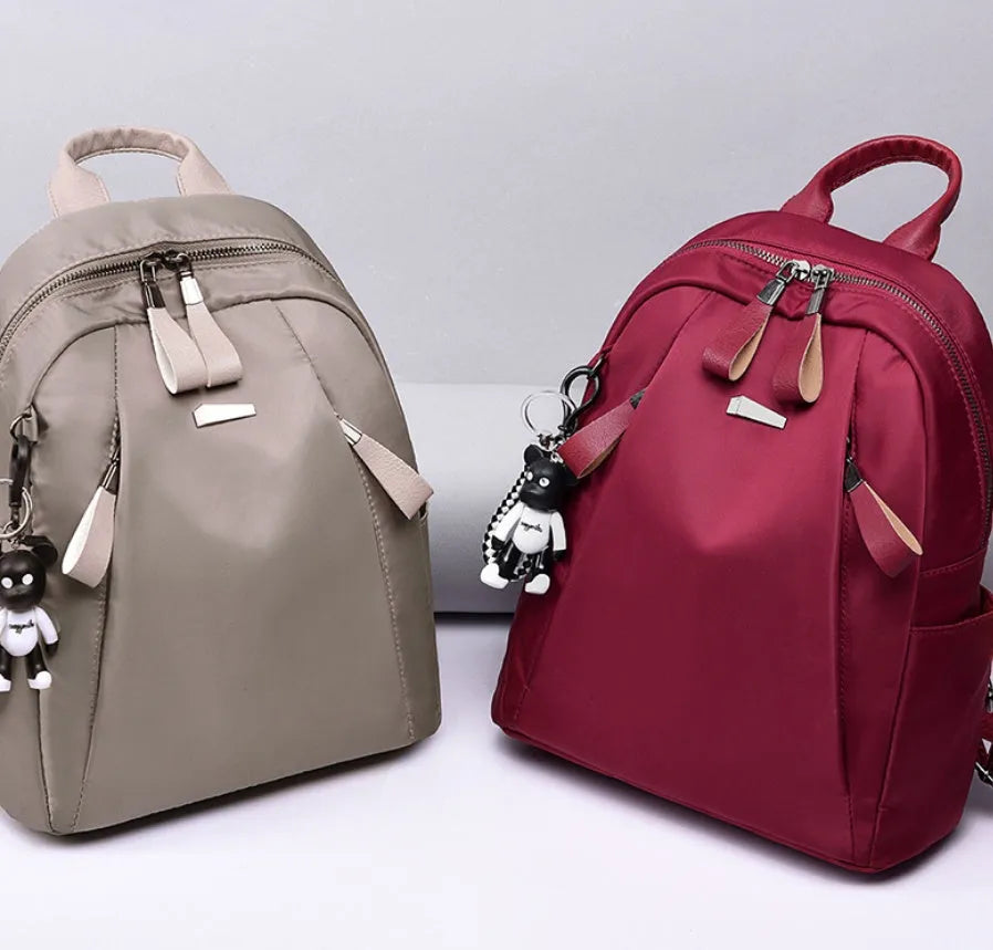 Medium Oxford cloth rucksack in wine red colour showing internal organisation pockets