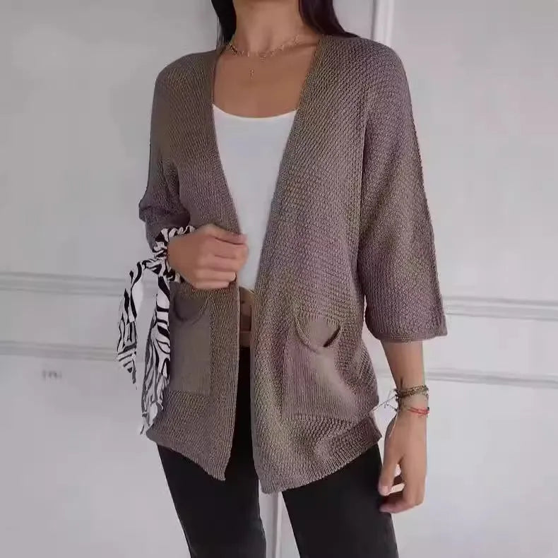 Women's waffle knit cardigan coat with nine-quarter length sleeves and pockets in army green.