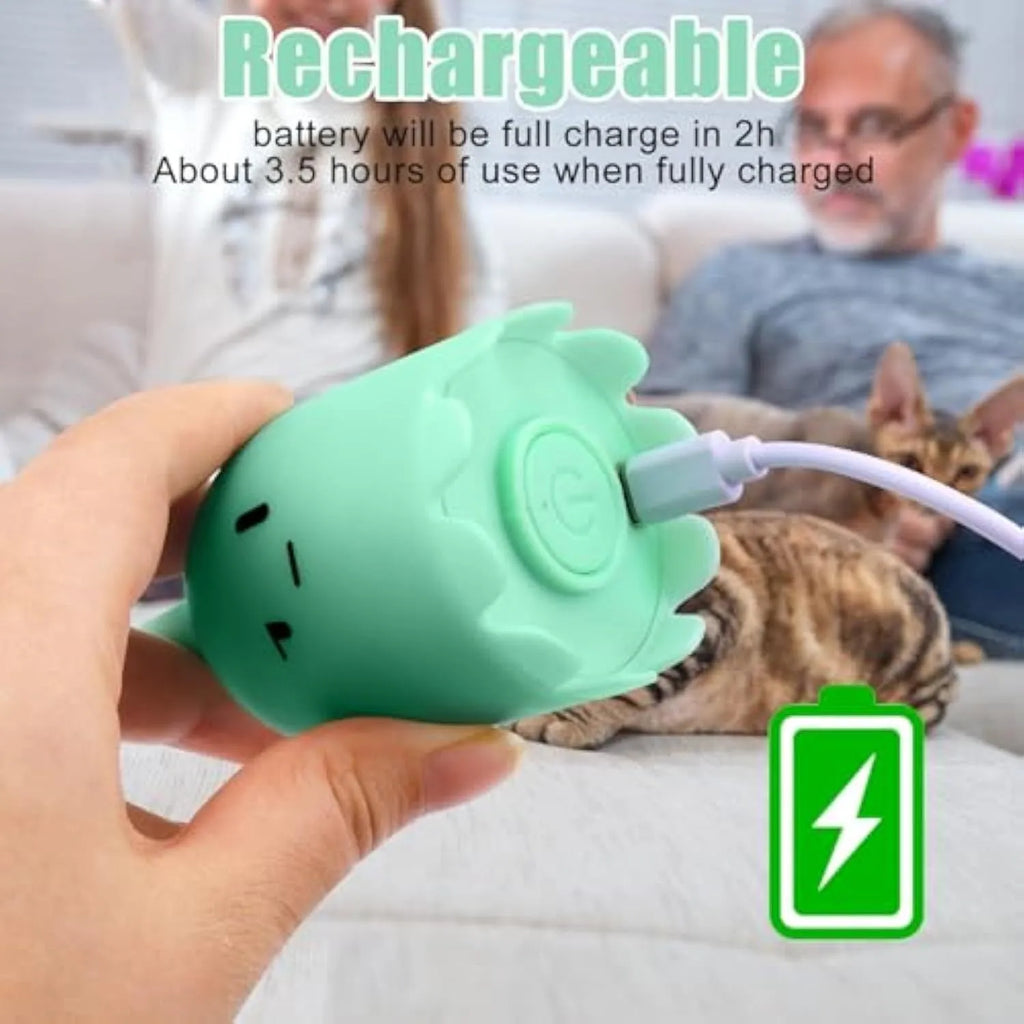 Green automatic cat wand toy with swinging silicone tails on wooden floor