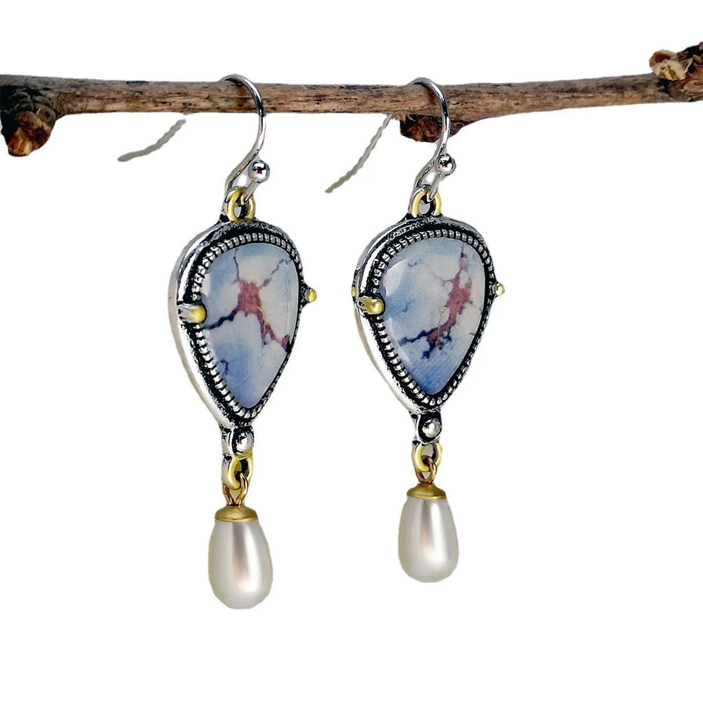 Bohemian geometric drop earrings with synthetic blue opal and white pearls on retro blue electroplated metal