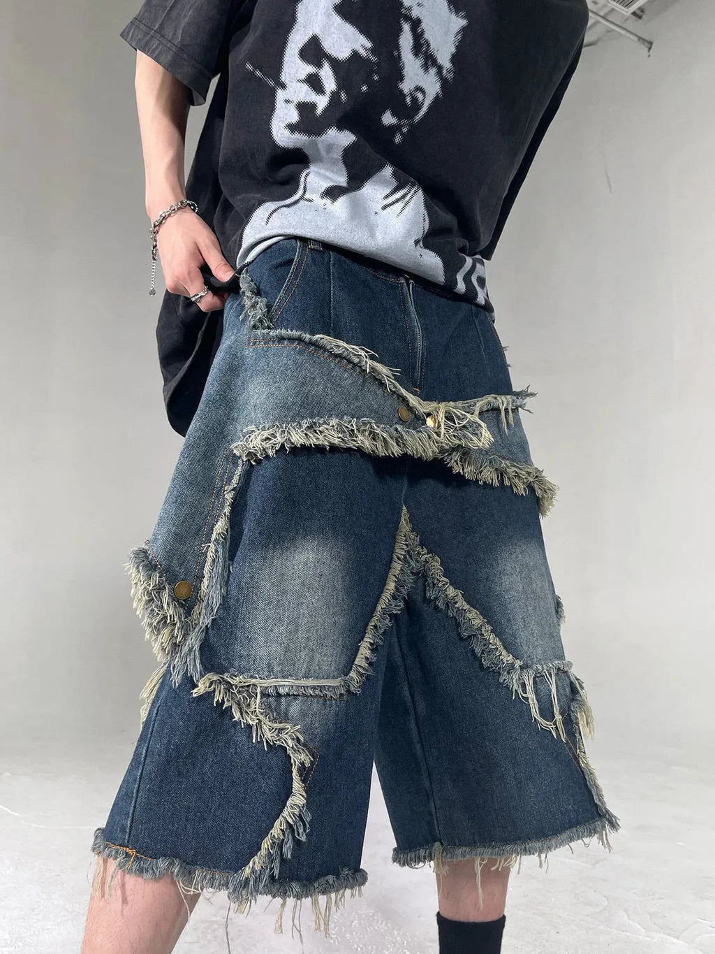 Blue men's denim shorts with frayed hem and five-pointed star patch in retro American style