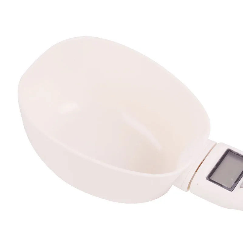 White ABS plastic smart weighing pet food shovel with digital display, 250ml capacity, 23cm length.