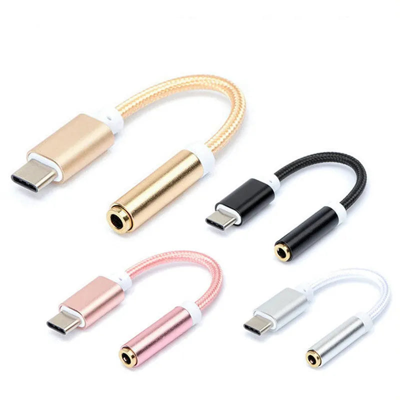 Close-up of a black nylon weave Type-C to 3.5mm female audio adapter cable on a white background.