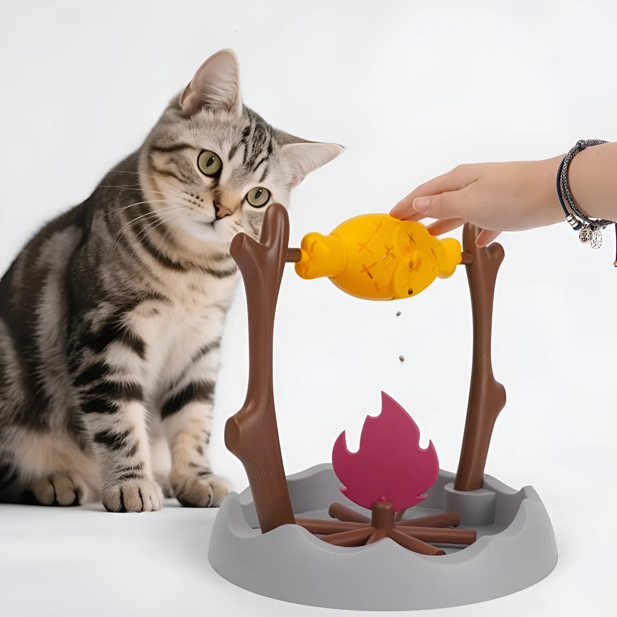 Barbecue-style plastic cat food dispenser toy for tumbling play and slow feeding