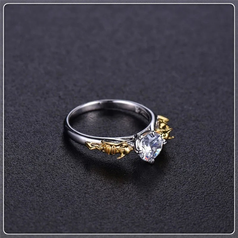 Copper crown cosplay ring with black gold finish and crystal details on a hand.
