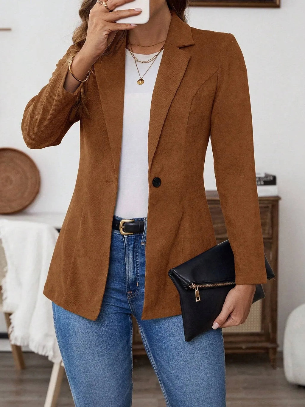 Brown men's single-breasted lapel blazer jacket on a hanger