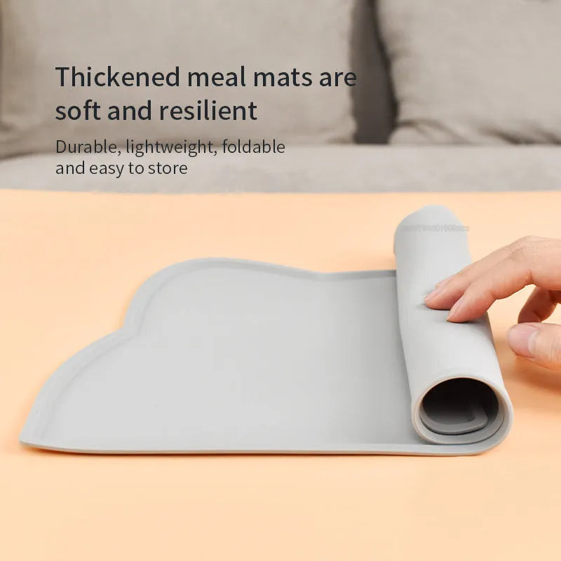 Blue silicone pet feeding mat with raised border for dog and cat food bowls