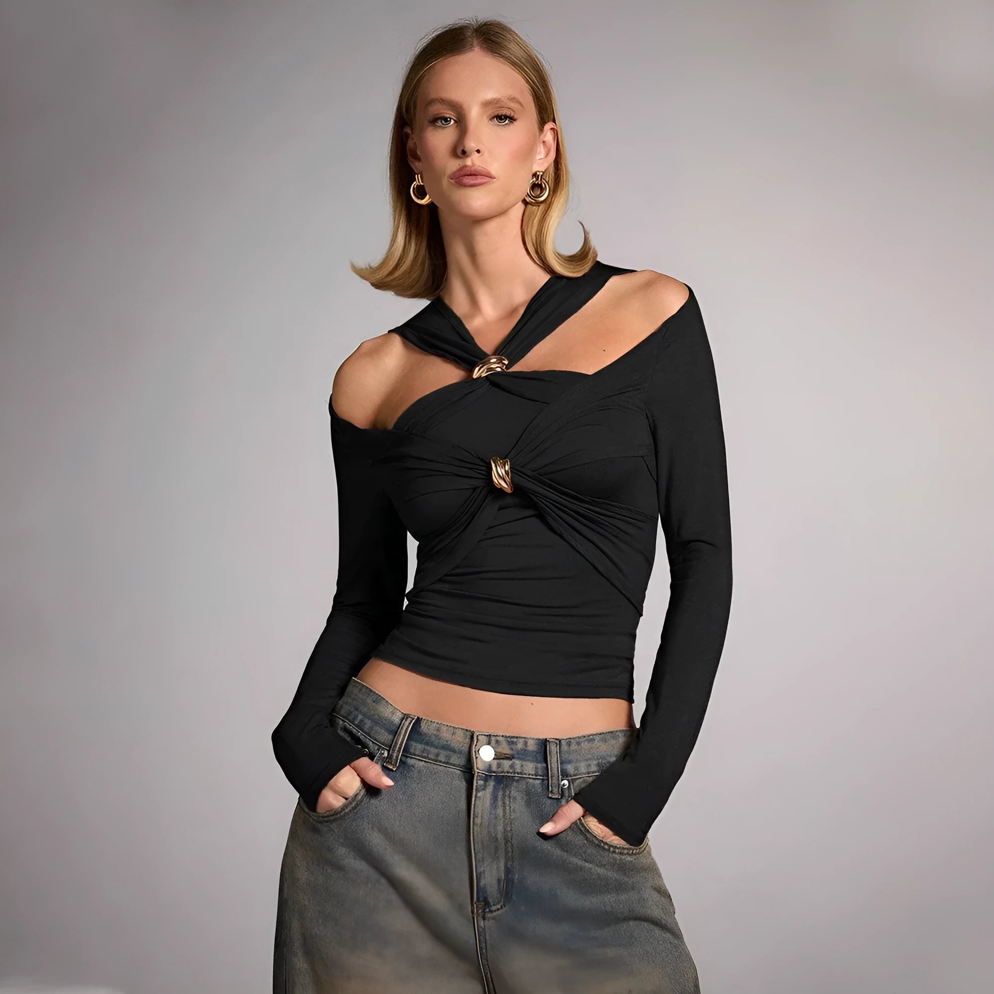 Black women's halter neck slim fit top with long sleeves on a mannequin.
