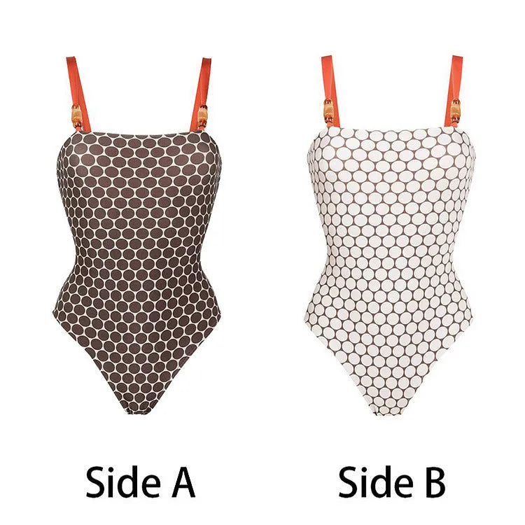 Women's dot-pattern one-piece swimsuit with matching wrap skirt set on a hanger.
