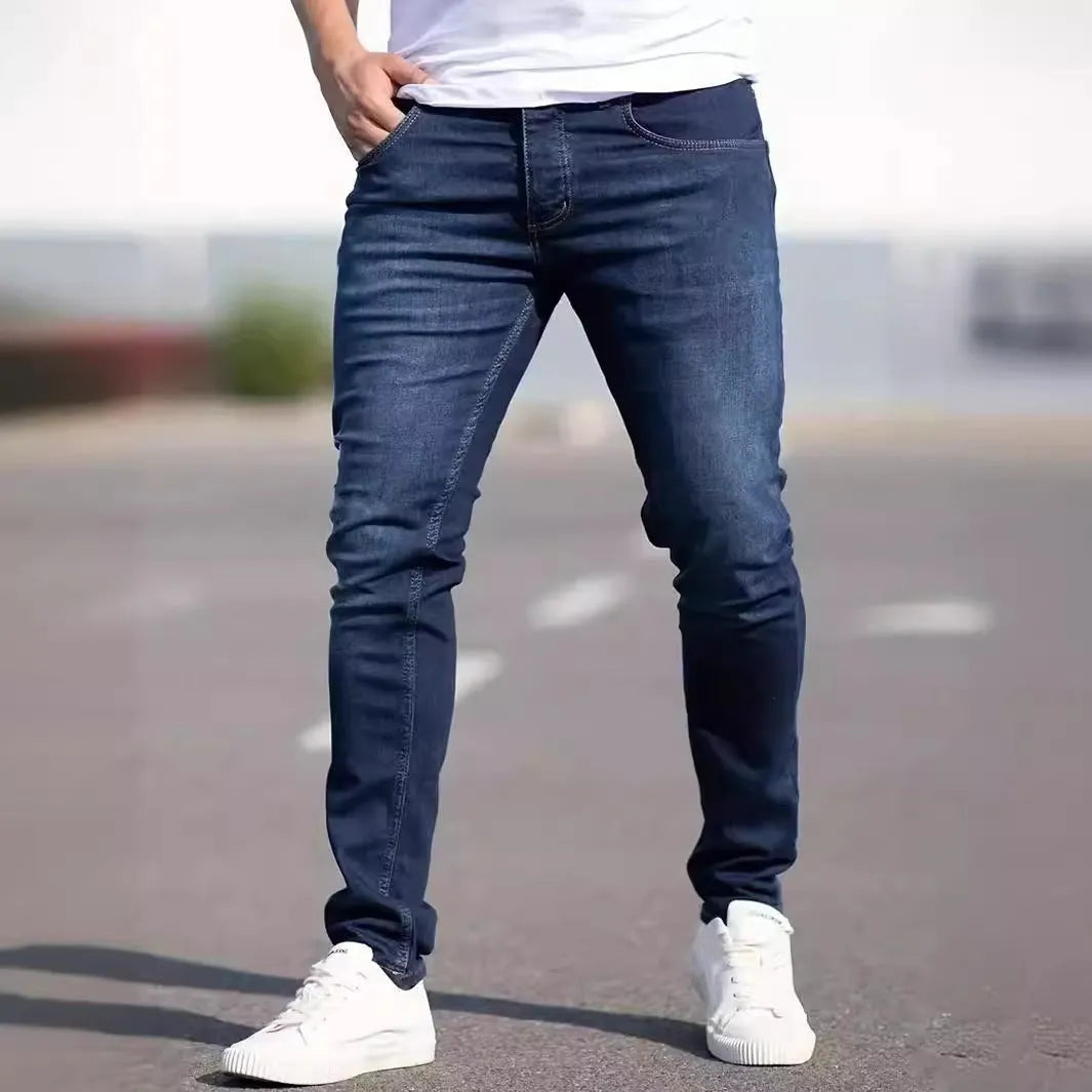 Men's dark blue skinny jeans with medium stretch cotton fabric and zipper fly