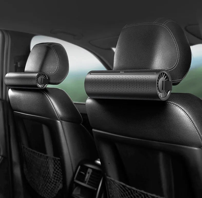 BASEUS black car air purifier with activated carbon crystal and magnetic enclosure on a car dashboard