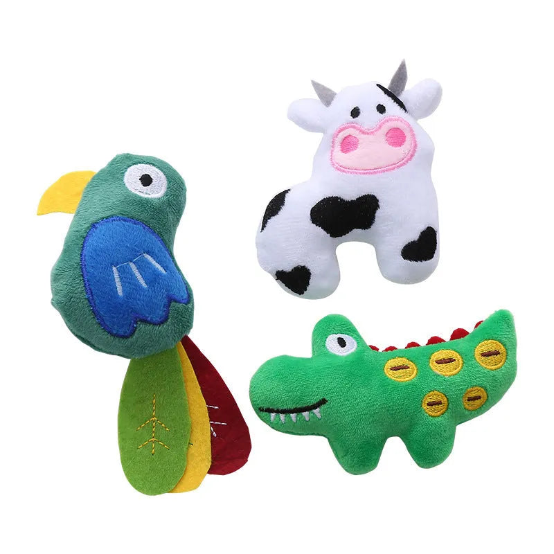 Plush green parrot-shaped cat toy with catnip, shown next to cow and crocodile versions.