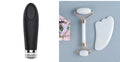 White jade dual-head facial roller and gua sha tool with a separate massage board on a plain background.