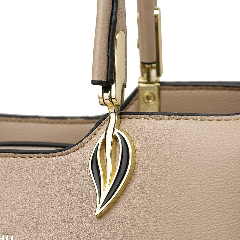 Women's black PU leather messenger bag with shoulder strap and sewing thread detailing