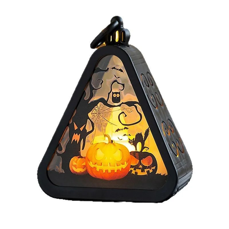 Halloween pumpkin lamp decoration prop in plastic and glass, showing one of four available colour designs.