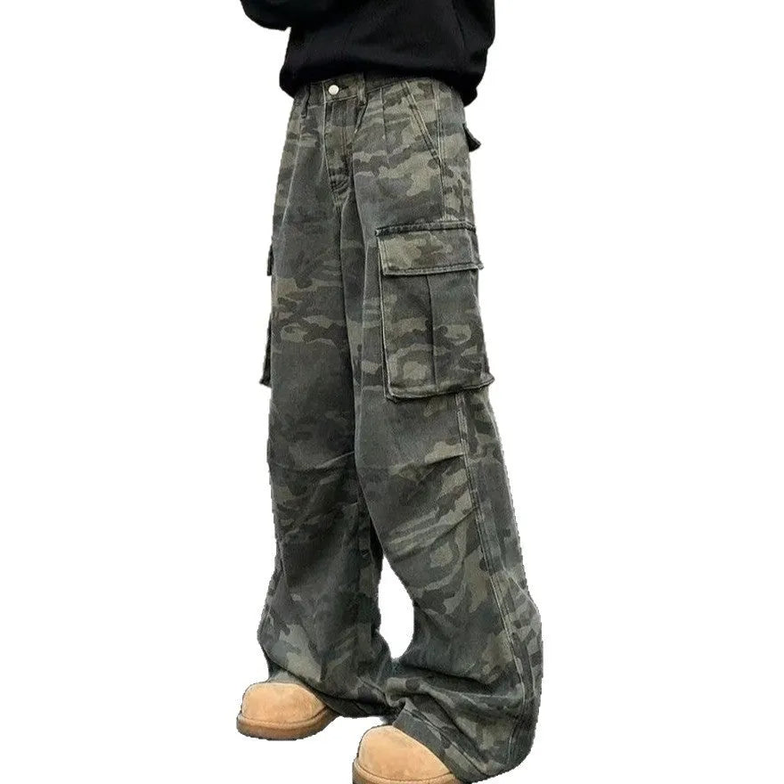 A pair of washed camouflage cotton blend cargo trousers with multiple pockets on a mannequin.