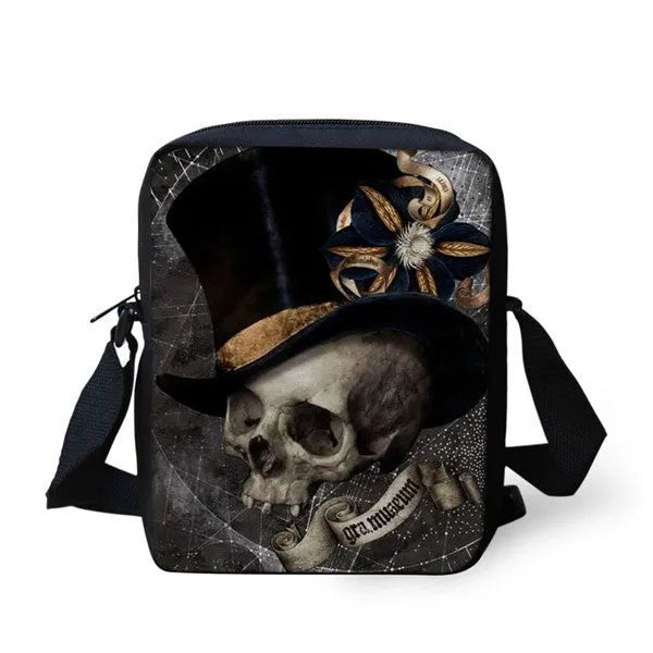 Medium-sized black children's messenger bag with a white skull pattern and double shoulder straps.