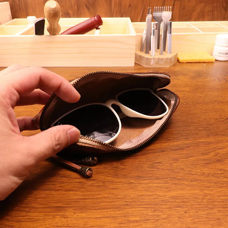 First layer cowhide leather glasses buggy bag in black colour on a neutral background