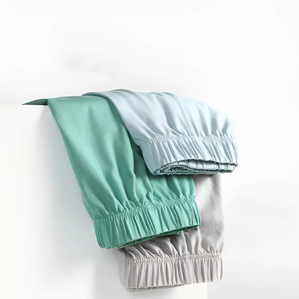 Men's loose-fitting cotton boxer shorts in solid colours on a hanger