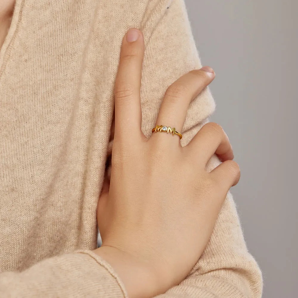 MOM Design refined simple geometric letter ring for women in silver with gold and platinum colour options