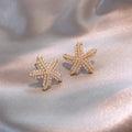 Women's gold electroplated alloy drop earrings with pineapple design and starfish pearl, featuring inlaid stones.