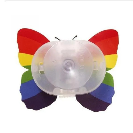 12 butterfly LED night lights with auto-change colours and suction pad on a surface