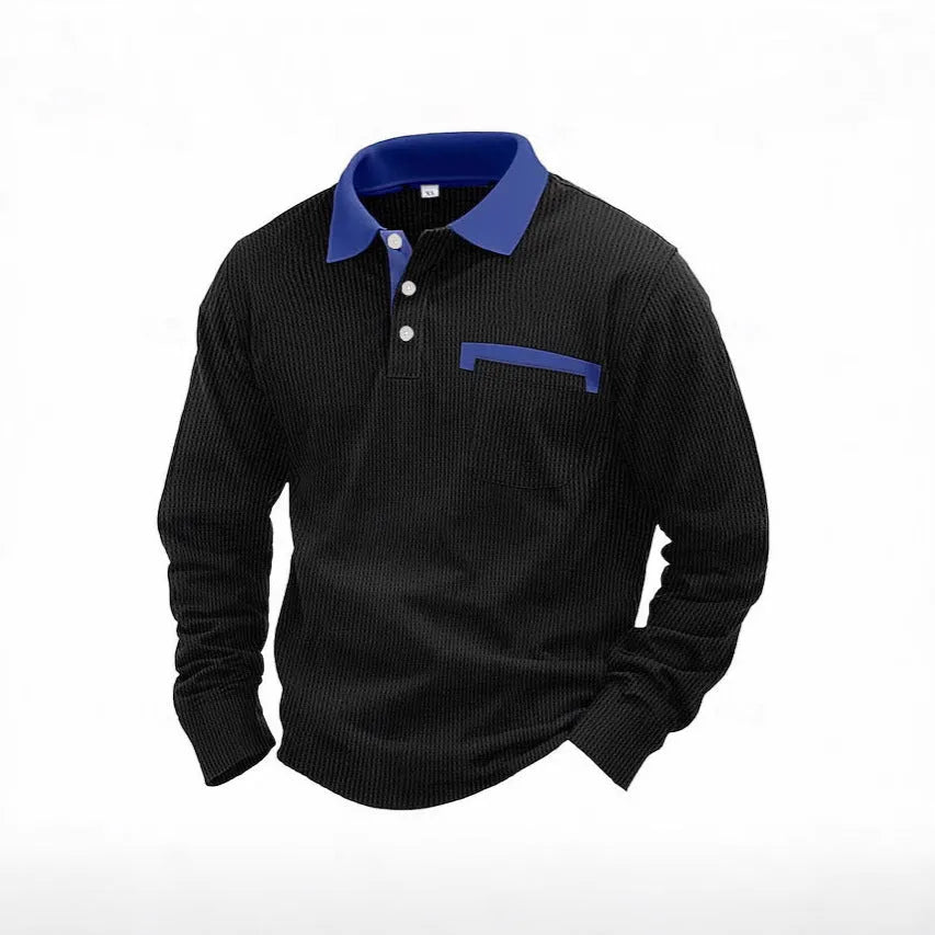 Man wearing a long-sleeved waffle-texture polo shirt with an asymmetric design in a dark colour.