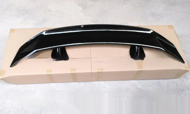 Universal punch-free car spoiler made from ABS plastic, shown in bright black finish.