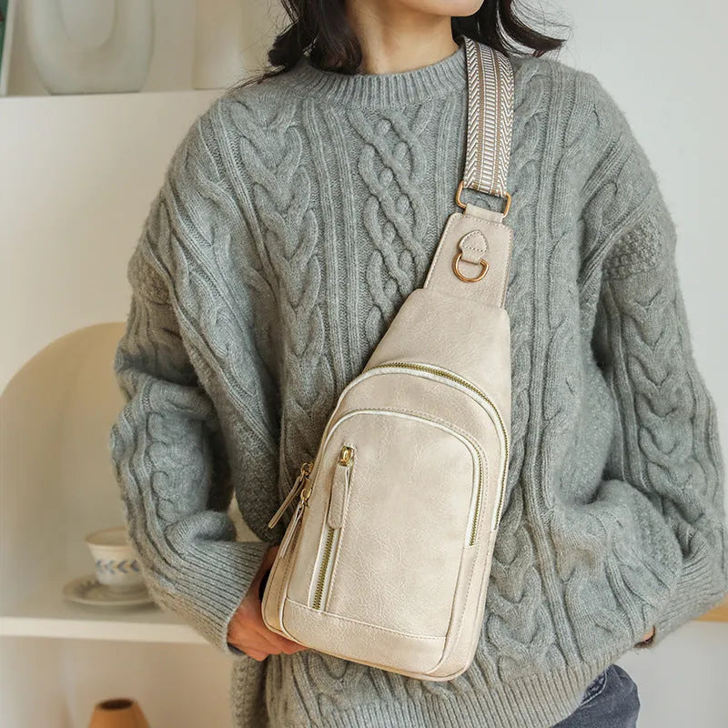 Women's soft PU chest bag in messenger style with crossbody strap and organised compartments