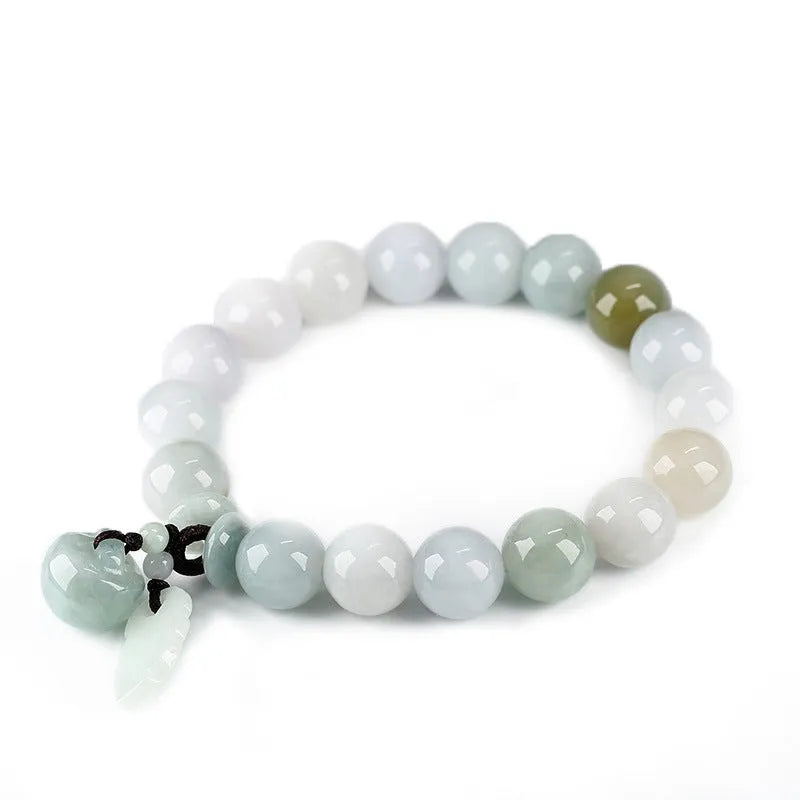Natural green jade bracelet with Maitreya Buddha charm pendant on a wrist.