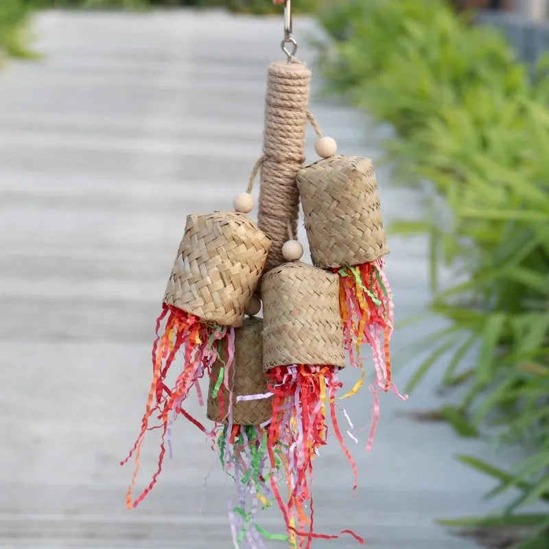 Wood and sisal rope parrot toy with colourful shredded paper strands for foraging.