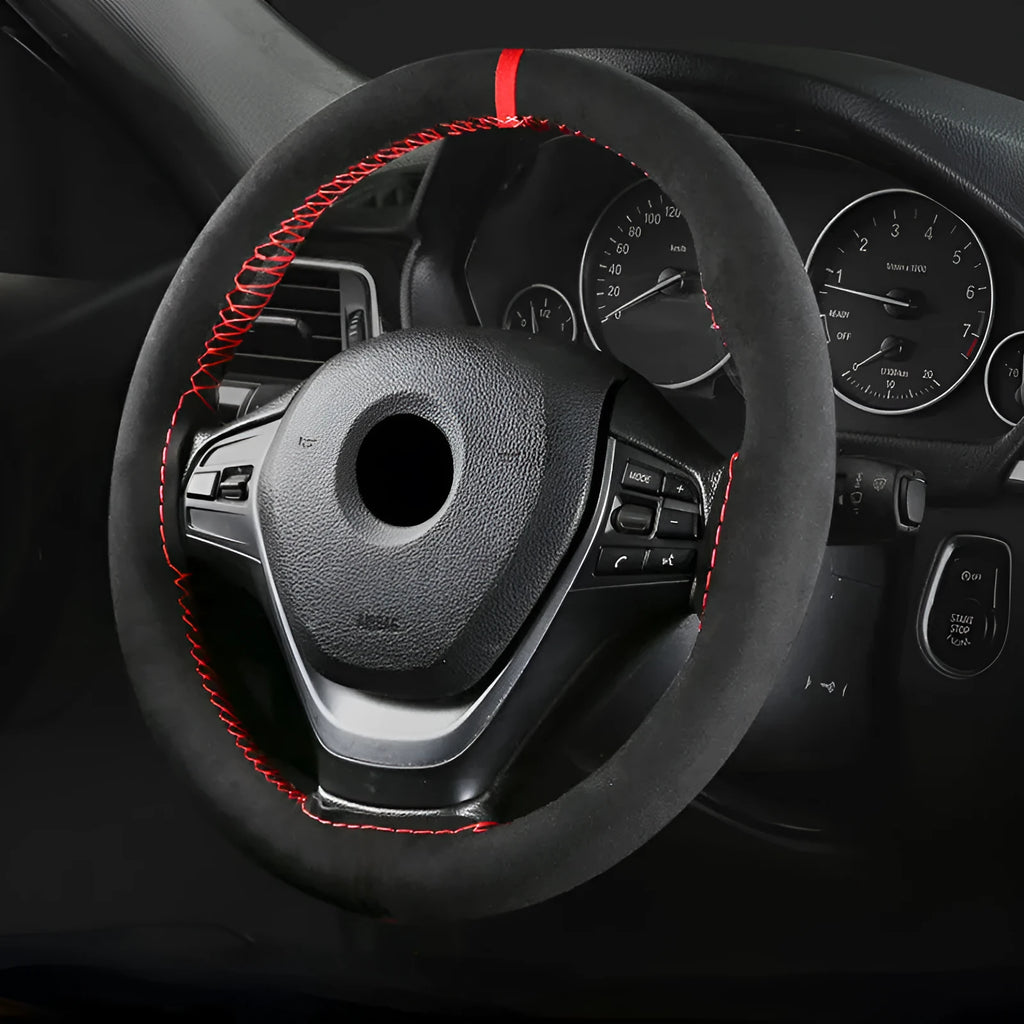 Black and red suede steering wheel cover fitted on a 38cm diameter car wheel.
