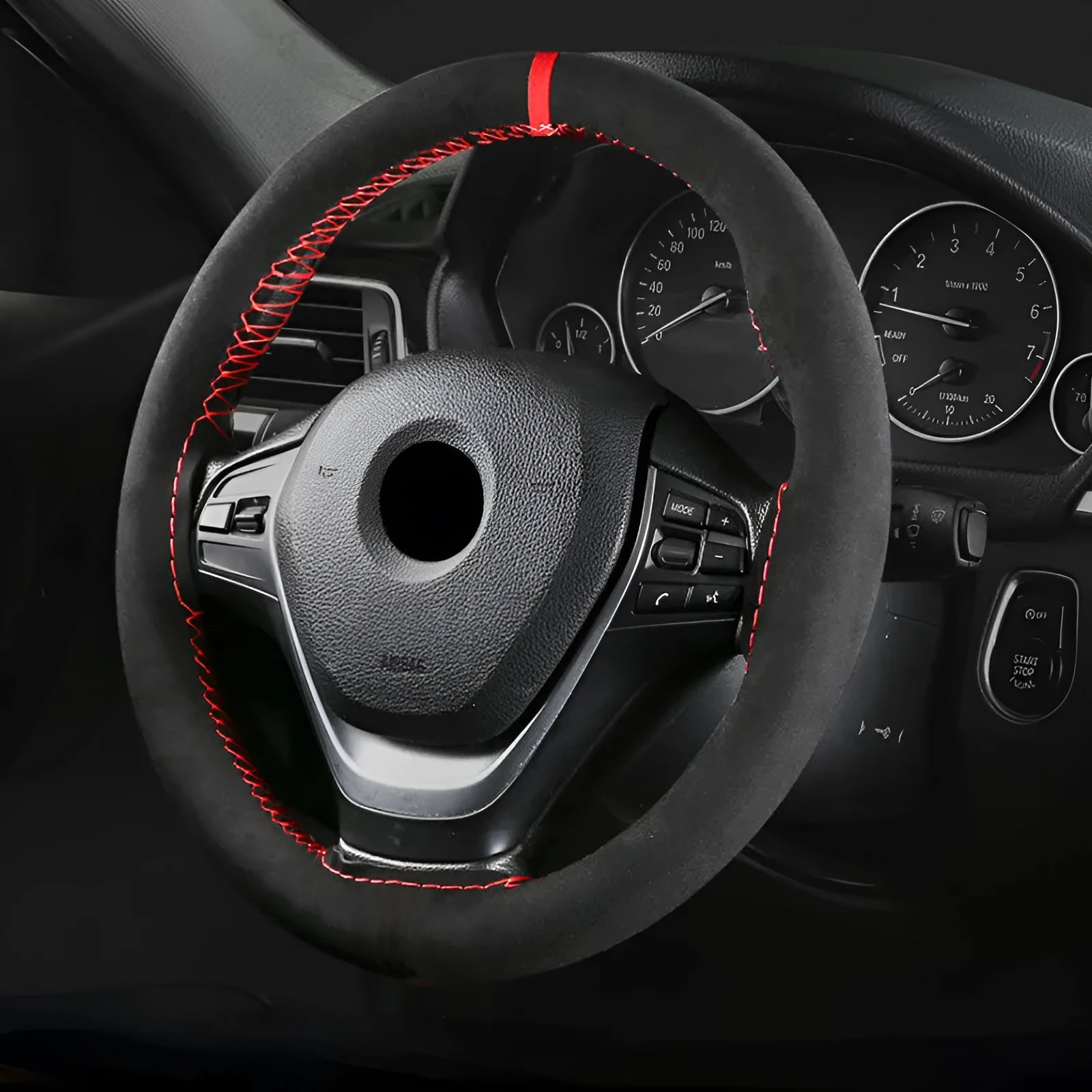 Black and red suede steering wheel cover fitted on a 38cm diameter car wheel.