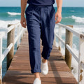 Men's straight-leg linen casual trousers in light khaki colour with a drawstring waist.