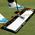 Black neoprene golf swing posture training pad on a practice surface