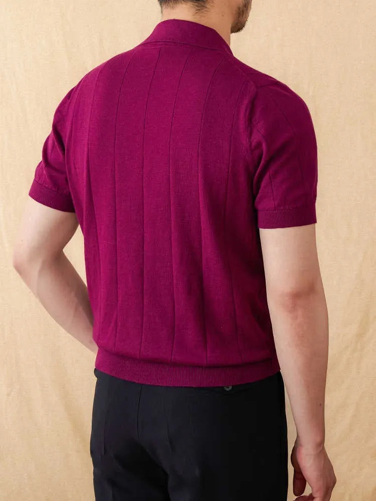 Knitted short sleeve polo collar top with sunken stripe pattern in dark blue.