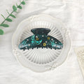 Oversized irregular-shaped barrette hair clip with a blue star moon starry sky celestial print.