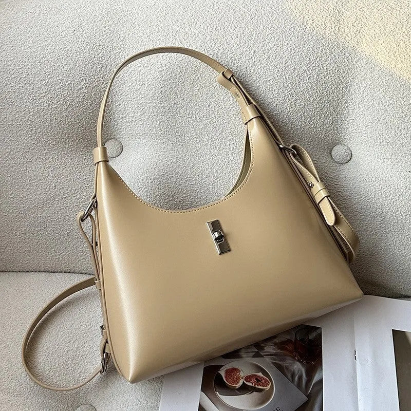 Women's genuine leather dumpling-shaped crossbody shoulder bag in apricot colour with a sandwich pocket.